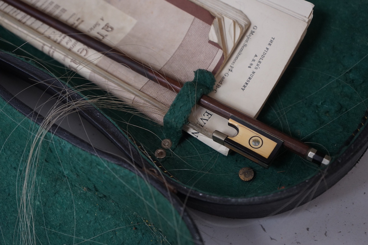 A cased full length violin, circa 1900 with bow, bears Stradivarius label to the interior. CITES Submission reference WVME8714